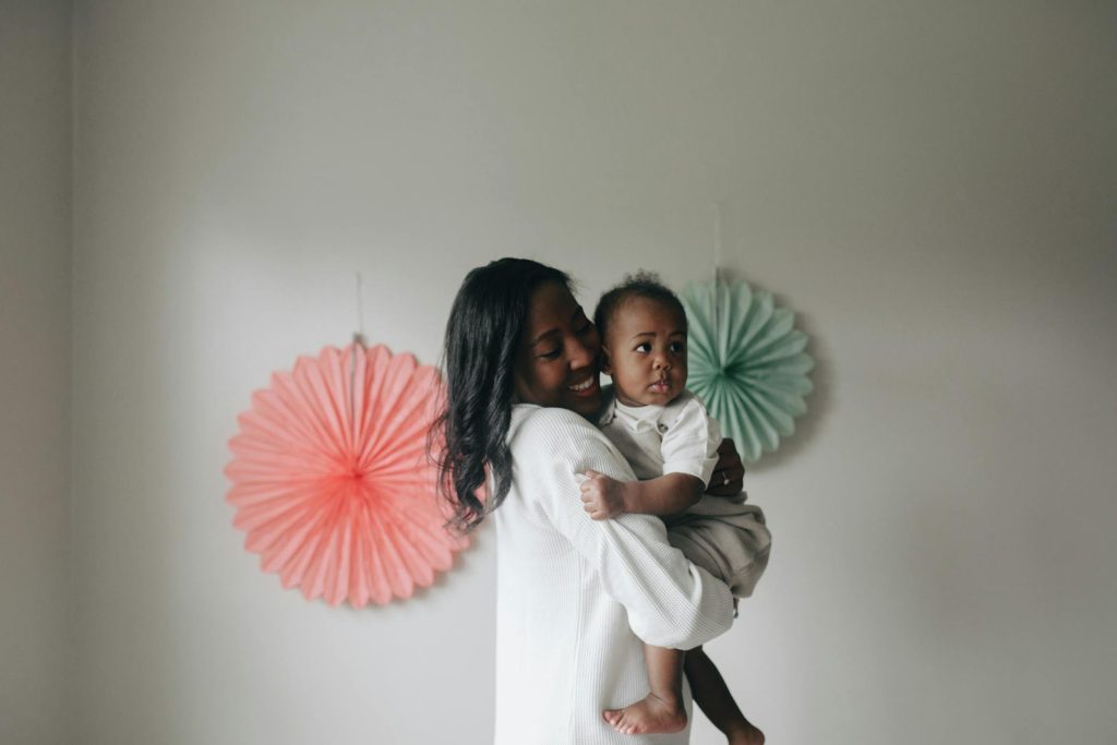 A mother gently holding her newborn