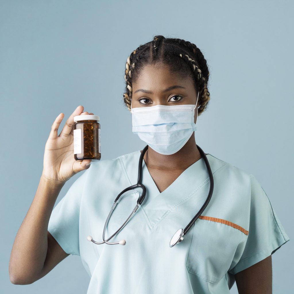 A nurse holding prescribed medicine