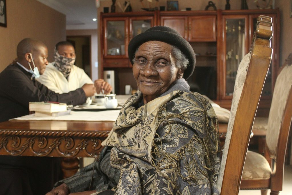 A smiling elderly woman at home
